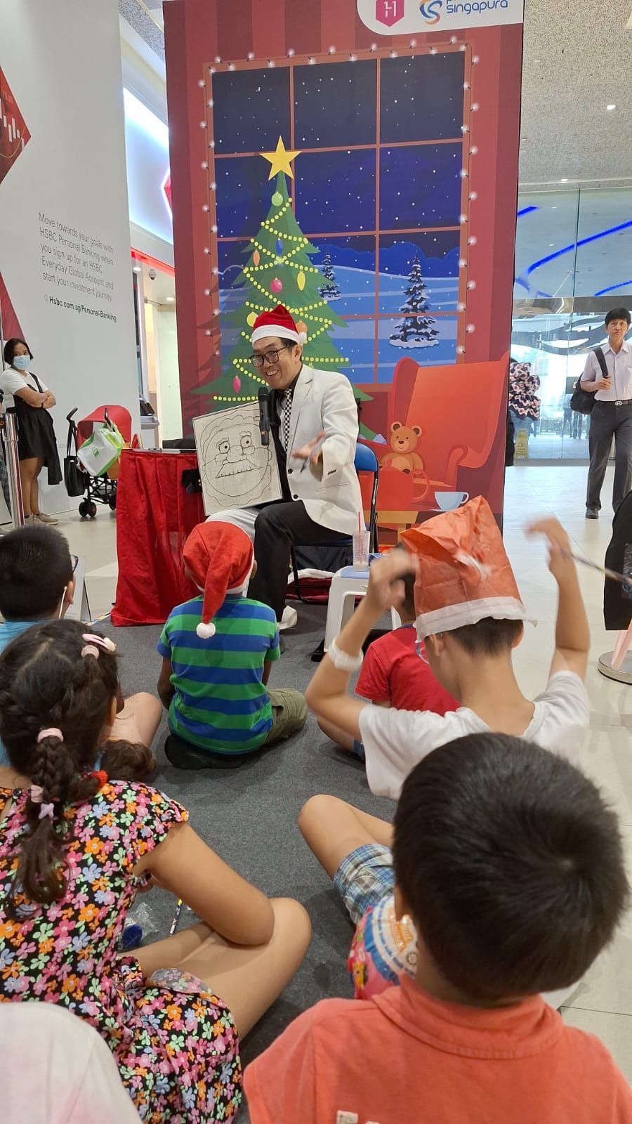 Magician performing the Santa magic drawing board